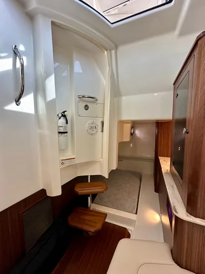 Breeezy Yacht Photos Pics Interior of 2020 Pursuit DC 365 Dual Console with wood accents.