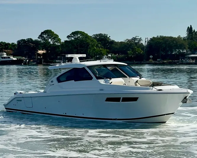 Breeezy Yacht Photos Pics 2020 Pursuit DC 365 Dual Console on calm water.