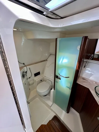 Breeezy Yacht Photos Pics Interior view of 2020 Pursuit DC 365 Dual Console bathroom.