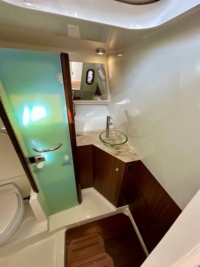 Breeezy Yacht Photos Pics Interior of 2020 Pursuit DC 365 Dual Console with sink and toilet.