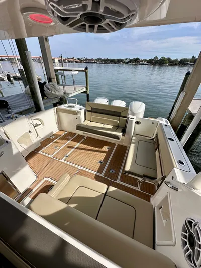 Breeezy Yacht Photos Pics Interior of 2020 Pursuit DC 365 Dual Console with seating area.
