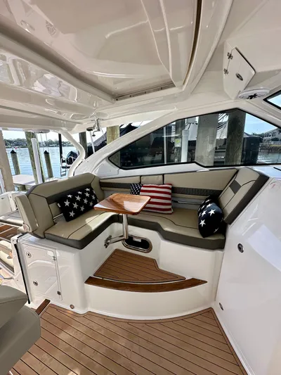 Breeezy Yacht Photos Pics Interior of 2020 Pursuit DC 365 Dual Console with American flag cushions.