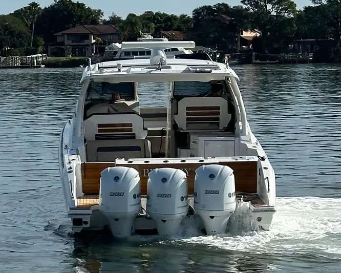 Breeezy Yacht Photos Pics 2020 Pursuit DC 365 Dual Console boat on calm water.