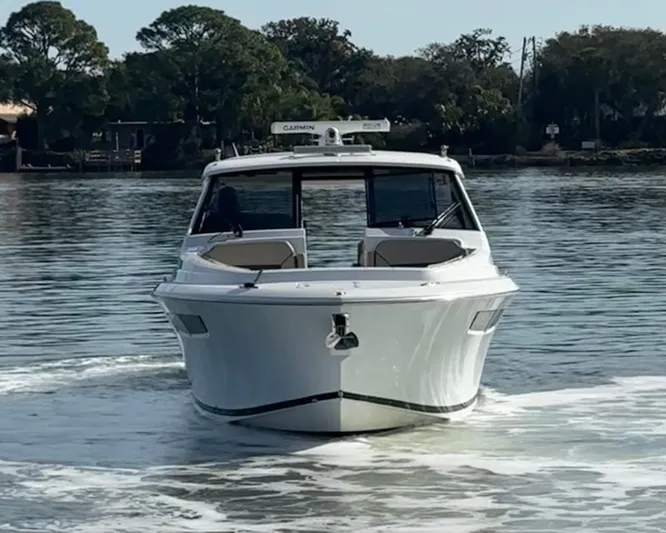 Breeezy Yacht Photos Pics 2020 Pursuit DC 365 Dual Console on calm water.