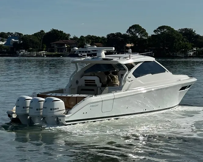 Breeezy Yacht Photos Pics 2020 Pursuit DC 365 Dual Console boat on calm water.
