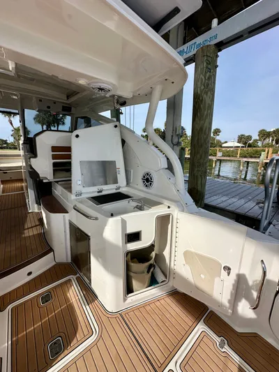 Breeezy Yacht Photos Pics 2020 Pursuit DC 365 Dual Console with open cabin at dock.