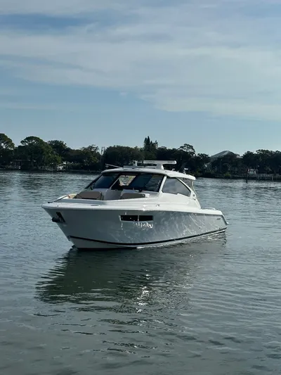 Breeezy Yacht Photos Pics 2020 Pursuit DC 365 Dual Console on calm water.
