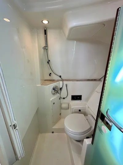 Breeezy Yacht Photos Pics Interior of 2020 Pursuit DC 365 Dual Console with toilet and shower.