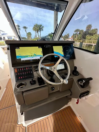 Breeezy Yacht Photos Pics 2020 Pursuit DC 365 Dual Console helm with navigation screens.