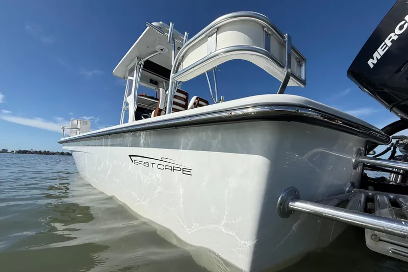  Yacht Photos Pics 2024 East Cape 25 Hybrid boat on water, showcasing sleek design and modern features.