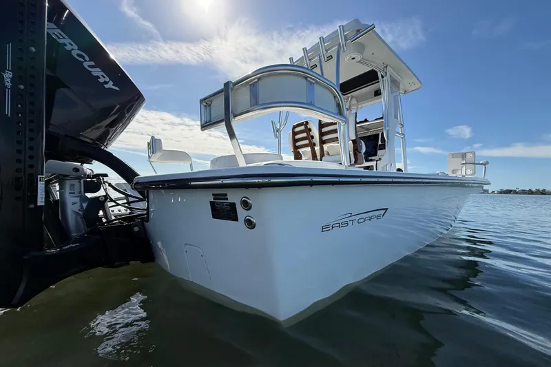  Yacht Photos Pics 2024 East Cape 25 Hybrid boat on water, featuring sleek design and Mercury engine.