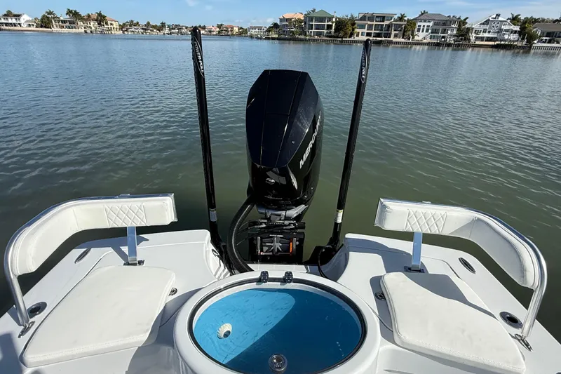  Yacht Photos Pics 2024 East Cape 25 Hybrid boat with Mercury engine on calm water.