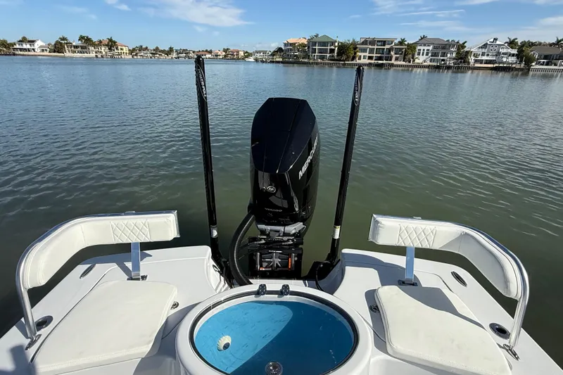  Yacht Photos Pics 2024 East Cape 25 Hybrid boat with Mercury engine on calm water.