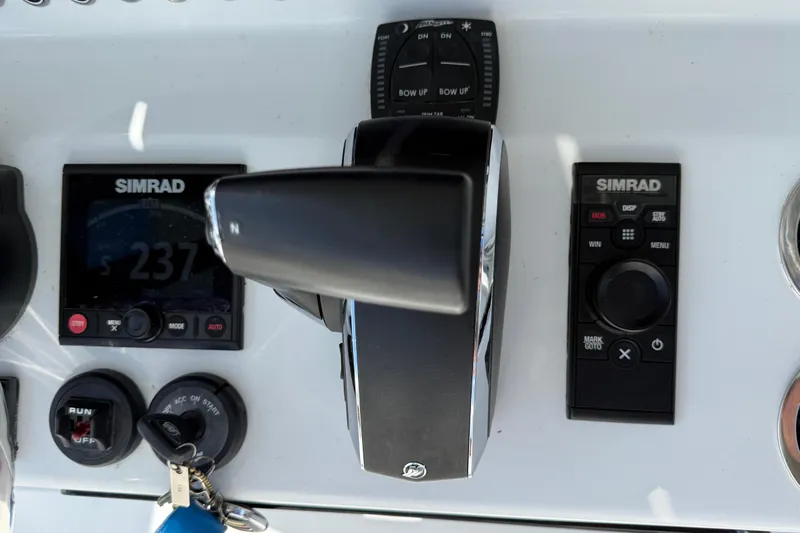  Yacht Photos Pics 2024 East Cape 25 Hybrid boat dashboard with Simrad controls and throttle.
