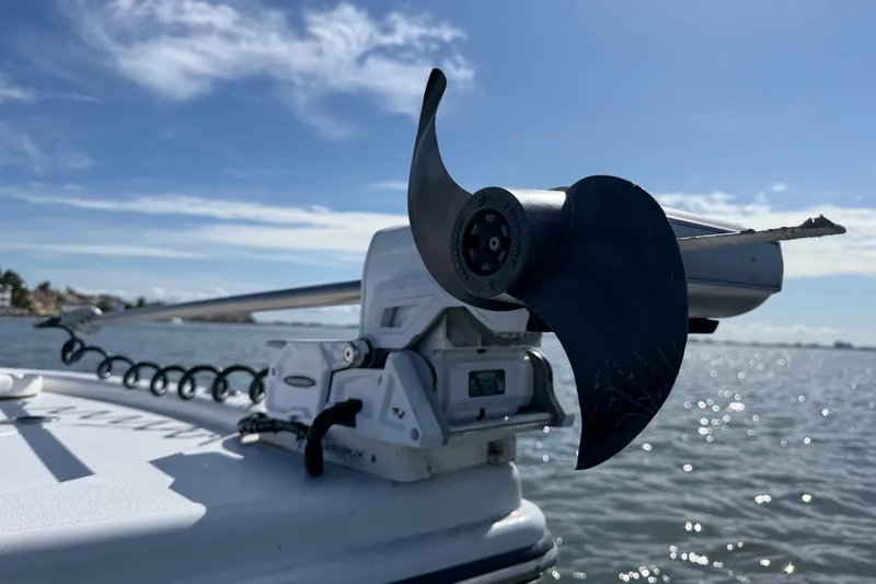  Yacht Photos Pics Close-up of 2024 East Cape 25 Hybrid boat motor on water.