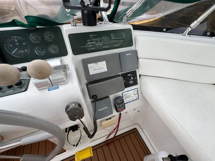 Amities Yacht Photos Pics 1998 Mainship 47 Motor Yacht helm with gauges, controls, and navigation equipment.