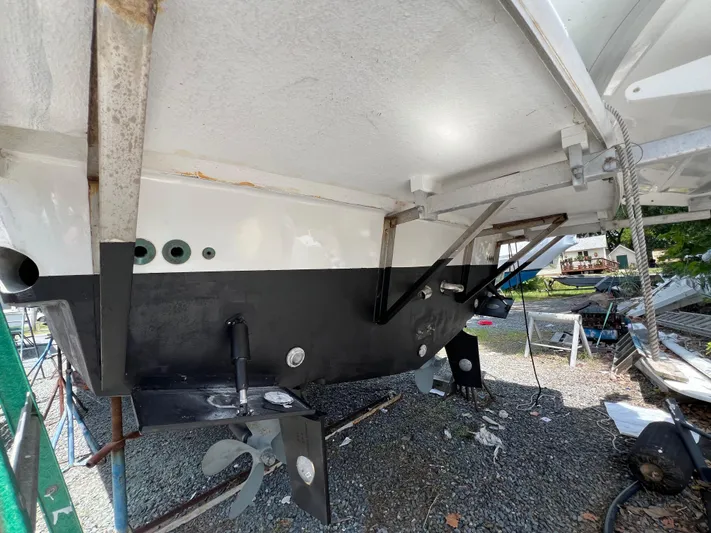 Amities Yacht Photos Pics 1998 Mainship 47 Motor Yacht under maintenance, showing hull and propeller details.