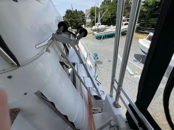 Amities Yacht Photos Pics 1998 Mainship 47 Motor Yacht on dry dock, showing deck and surrounding boats.