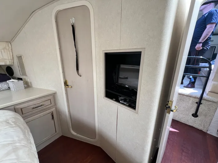 Amities Yacht Photos Pics Interior of 1998 Mainship 47 Motor Yacht with TV and storage.