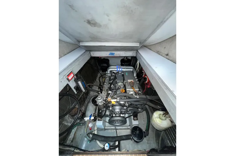 Sea Change Yacht Photos Pics Engine compartment of a 2003 Endeavour 36 TrawlerCat, showcasing mechanical components.