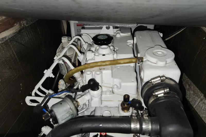 Sea Change Yacht Photos Pics Engine compartment of a 2003 Endeavour 36 TrawlerCat, showcasing mechanical components.