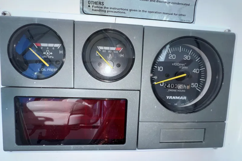 Sea Change Yacht Photos Pics Dashboard gauges of a 2003 Endeavour 36 TrawlerCat, showing oil pressure and engine hours.