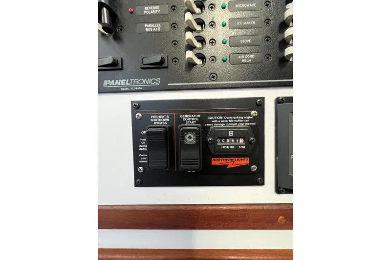 Sea Change Yacht Photos Pics Control panel of a 2003 Endeavour 36 TrawlerCat, featuring generator and electrical switches.
