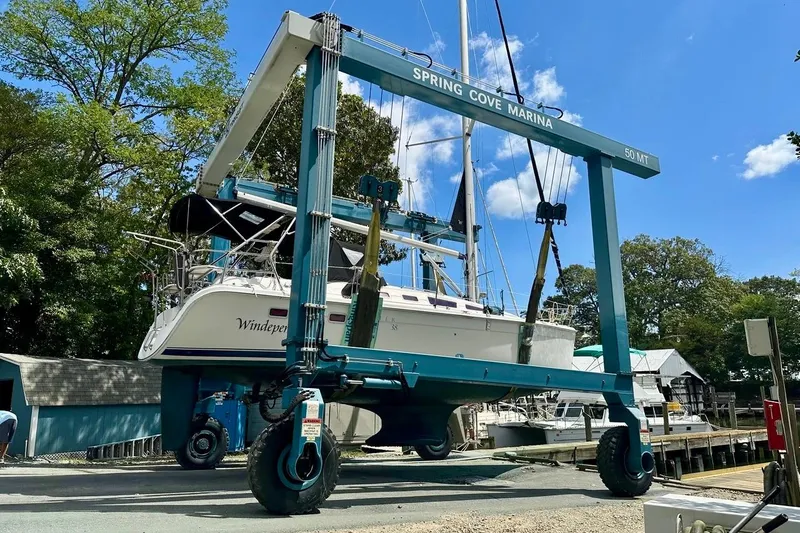 Windependence Yacht Photos Pics Hunter 38 sailboat from 2006 being lifted at Spring Cove Marina.