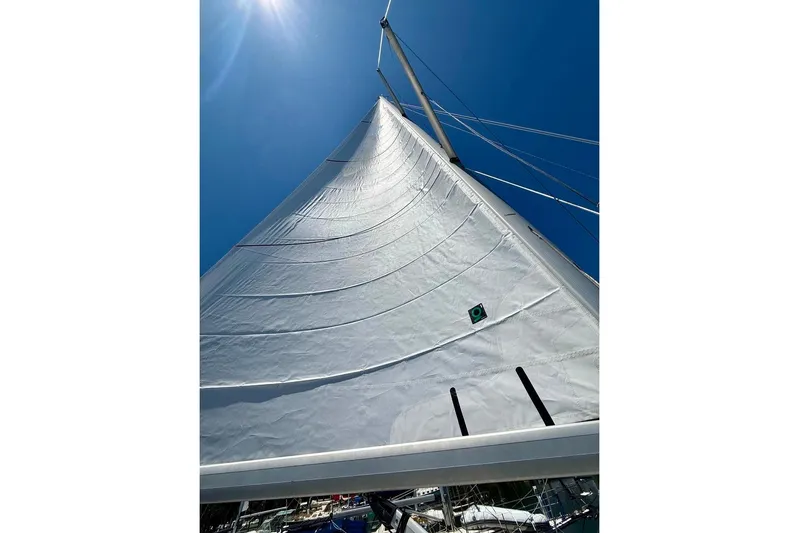 Windependence Yacht Photos Pics Sail of a 2006 Hunter 38 yacht against a clear blue sky.