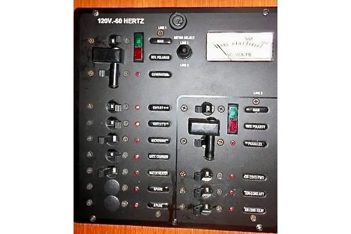 Windependence Yacht Photos Pics Electrical control panel on a 2006 Hunter 38 boat, featuring various switches and indicators.