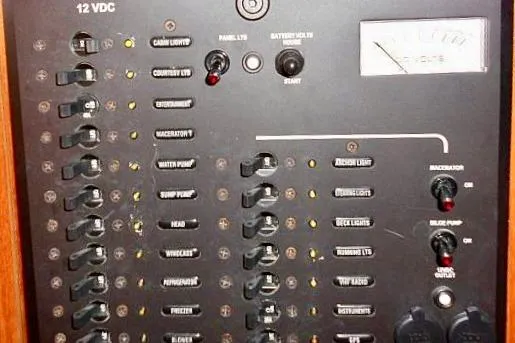 Windependence Yacht Photos Pics Electrical control panel of a 2006 Hunter 38 boat with various switches and indicators.