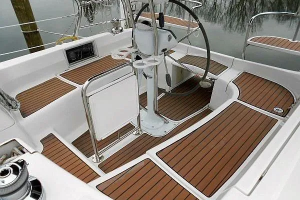 Windependence Yacht Photos Pics 2006 Hunter 38 sailboat cockpit with teak flooring and steering wheel.