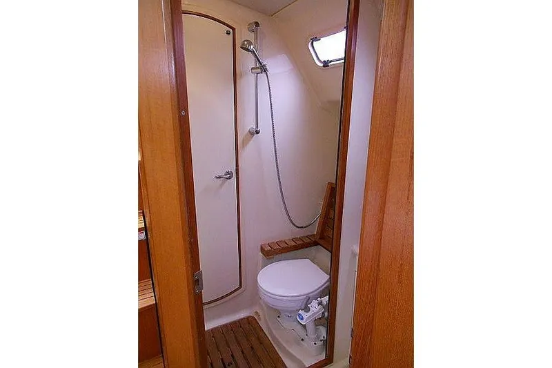 Windependence Yacht Photos Pics Compact bathroom in 2006 Hunter 38 sailboat with shower and toilet.