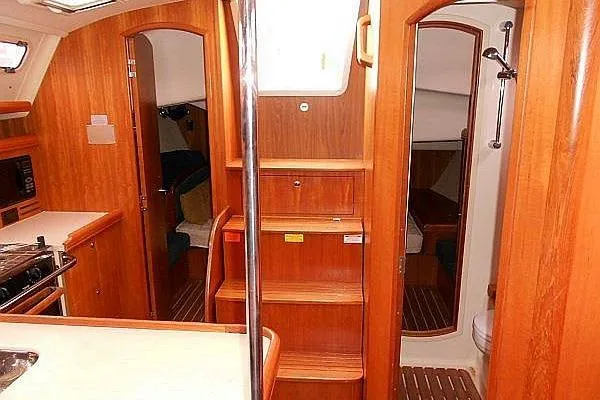 Windependence Yacht Photos Pics Interior of 2006 Hunter 38 sailboat with wood finish and compact layout.