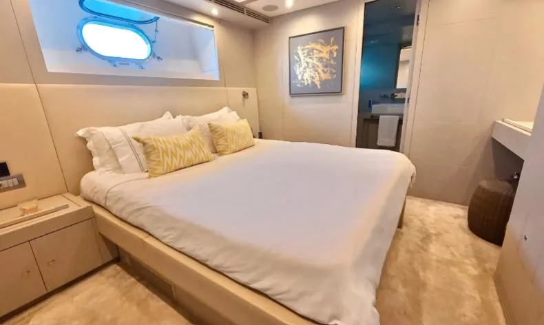  Yacht Photos Pics Luxurious bedroom on 2007 Riva 115 Athena yacht with modern decor and plush bedding.