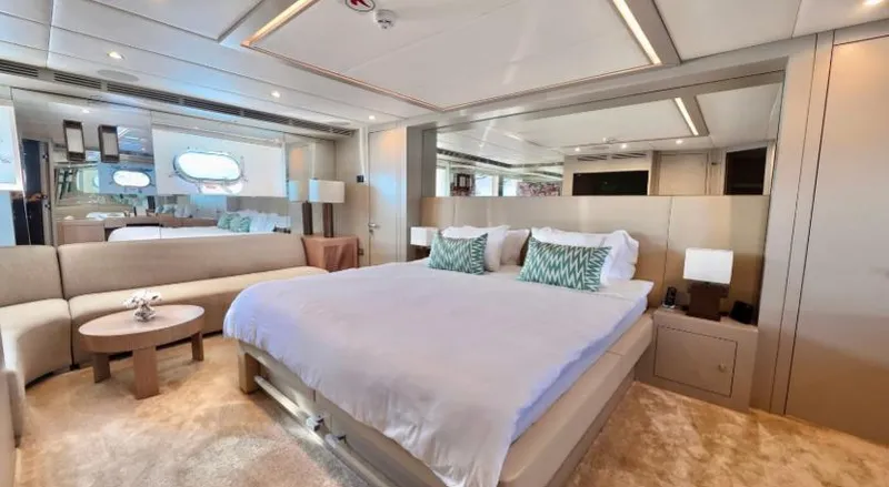  Yacht Photos Pics Luxurious bedroom interior on 2007 Riva 115 Athena yacht, featuring elegant decor and modern amenities.