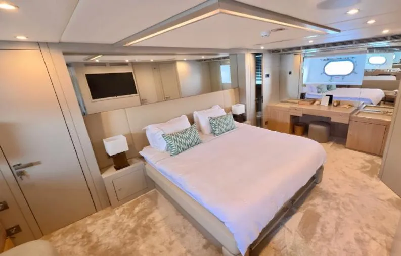  Yacht Photos Pics Luxurious bedroom interior on 2007 Riva 115 Athena yacht with modern decor and plush bedding.