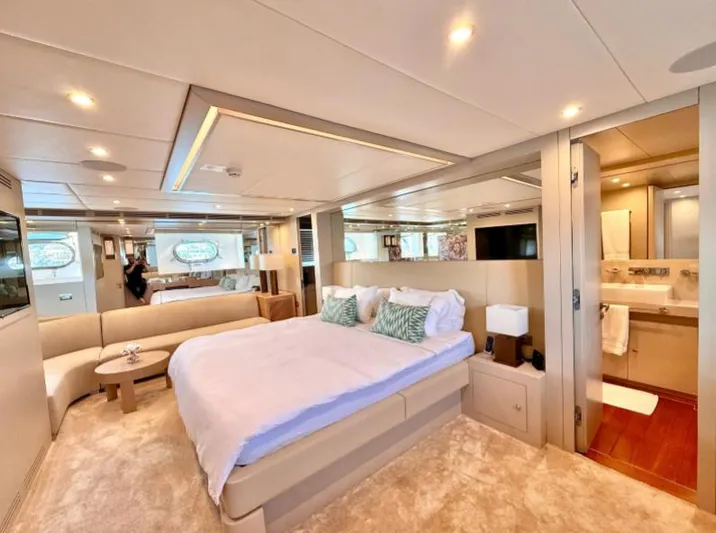  Yacht Photos Pics Luxurious bedroom interior of 2007 Riva 115 Athena yacht with modern decor and ensuite bathroom.