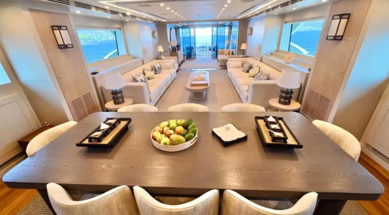  Yacht Photos Pics Luxurious interior of 2007 Riva 115 Athena yacht with elegant dining and seating areas.