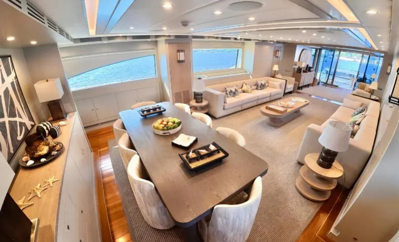  Yacht Photos Pics Luxurious interior of 2007 Riva 115 Athena yacht with elegant dining and seating areas.