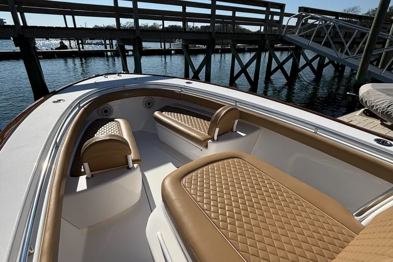  Yacht Photos Pics 2020 Valhalla Boatworks V-33 interior with tan quilted seating at dock.