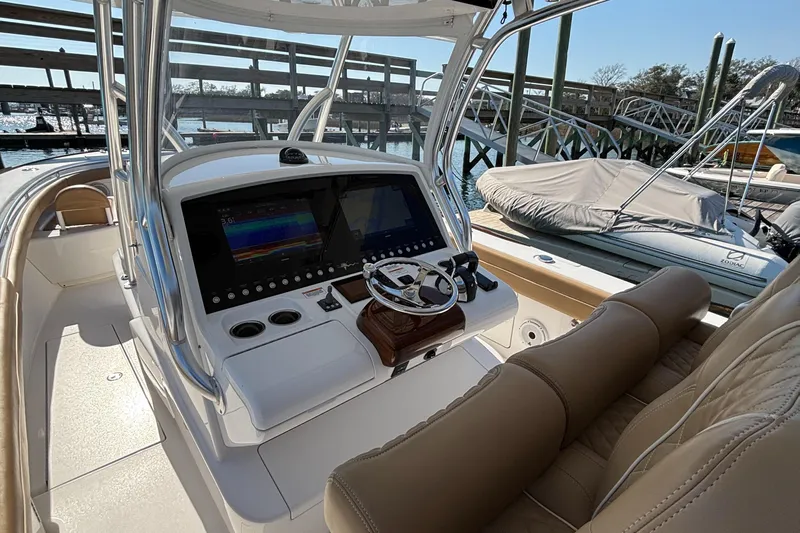  Yacht Photos Pics 2020 Valhalla Boatworks V-33 helm with dual displays and leather seating.