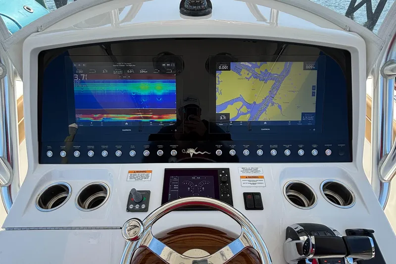  Yacht Photos Pics 2020 Valhalla Boatworks V-33 dashboard with navigation screens and controls.