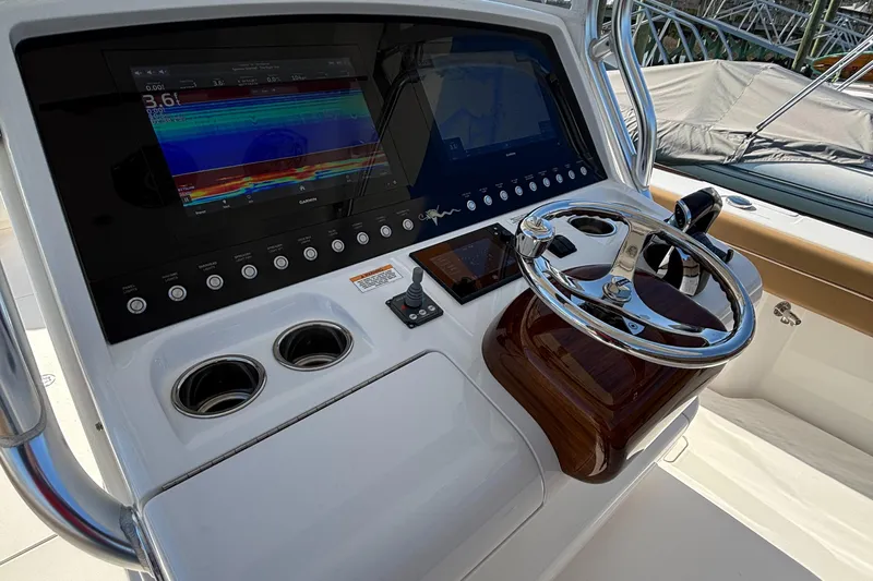  Yacht Photos Pics 2020 Valhalla Boatworks V-33 helm with advanced navigation display and steering wheel.