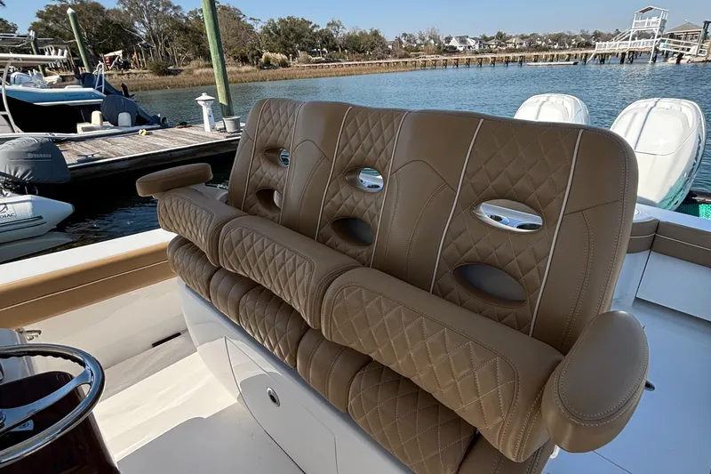  Yacht Photos Pics Luxurious seating on 2020 Valhalla Boatworks V-33, docked by the water.