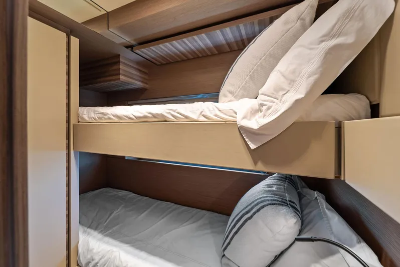 Giulia Yacht Photos Pics Bunk beds in 2023 Ferretti Yachts 670, featuring modern design and cozy bedding.
