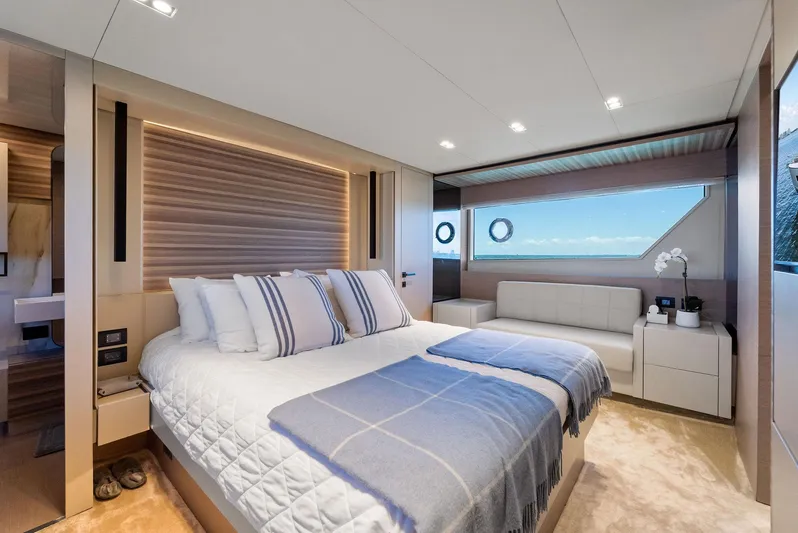 Giulia Yacht Photos Pics Luxurious bedroom interior on 2023 Ferretti Yachts 670, featuring elegant design and ocean view.