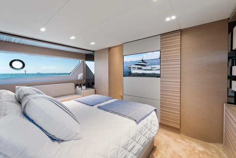 Giulia Yacht Photos Pics Luxurious bedroom interior of 2023 Ferretti Yachts 670 with ocean view and modern decor.