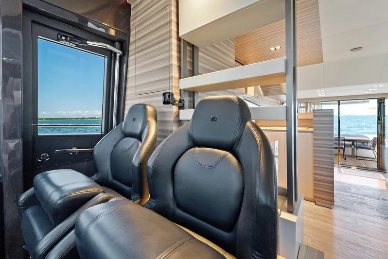 Giulia Yacht Photos Pics Luxurious interior of 2023 Ferretti Yachts 670, featuring sleek leather seating and modern design.