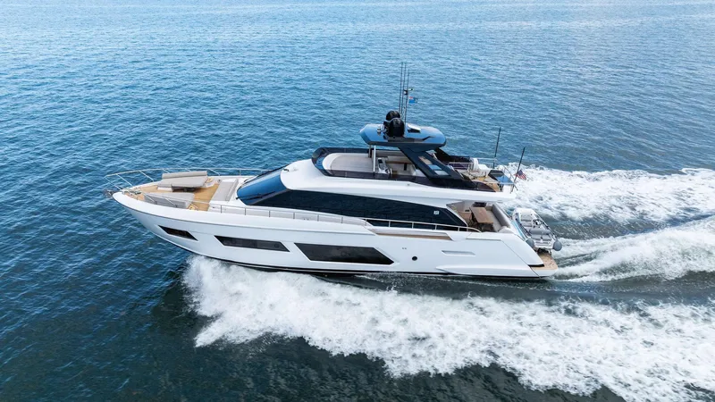 Giulia Yacht Photos Pics 2023 Ferretti Yachts 670 cruising on open water, showcasing sleek design and luxury features.